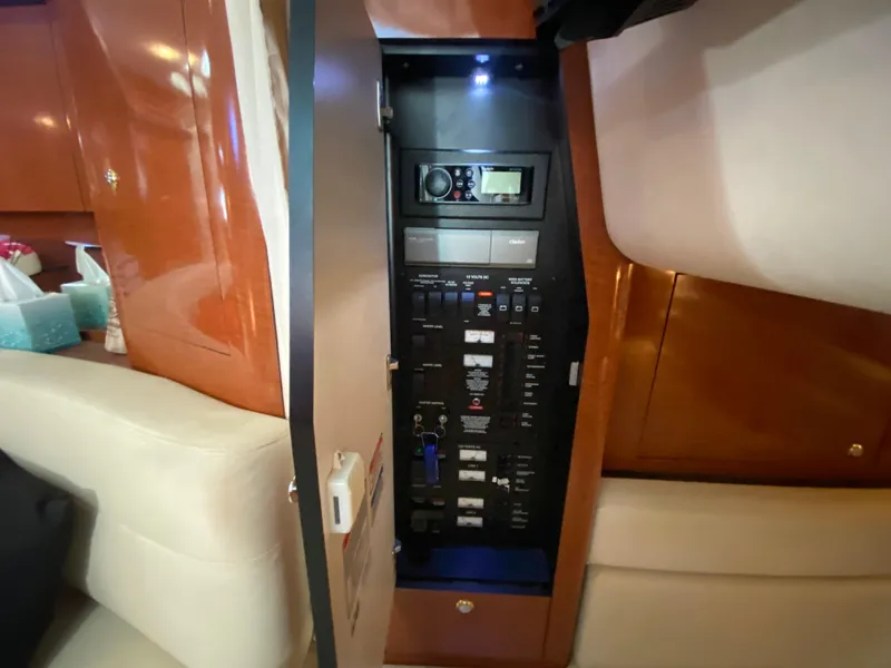 Slide: The Image of Electrical panel inside a 2003 Sea Ray 340 Sundancer yacht cabin. - 38