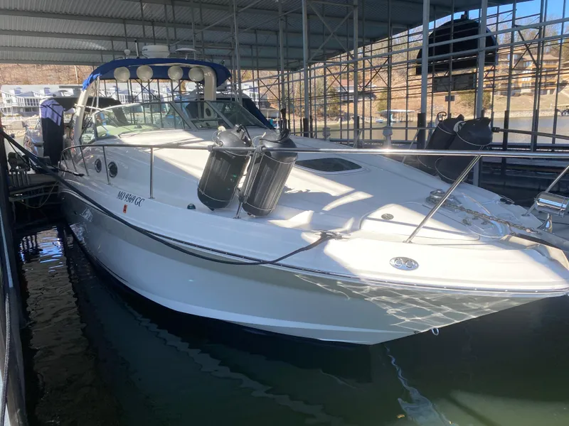 Slide: The Image of 2003 Sea Ray 340 Sundancer docked in a covered marina. - 5
