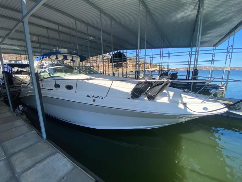Slide: The Image of 2003 Sea Ray 340 Sundancer docked in a covered marina. - 6