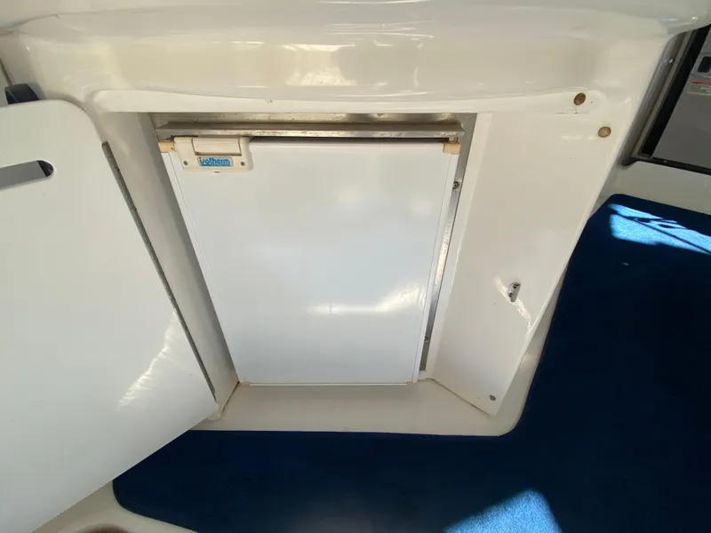 Slide: The Image of 2003 Sea Ray 340 Sundancer interior with built-in refrigerator. - 9