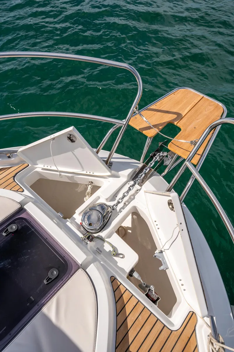 Slide: The Image of Bow of 2026 Beneteau Antares 11 OB with anchor and teak platform. - 12
