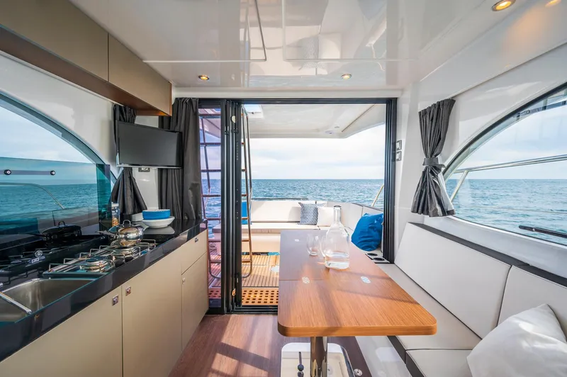 Slide: The Image of Interior of 2026 Beneteau Antares 11 OB yacht with ocean view and modern amenities. - 25