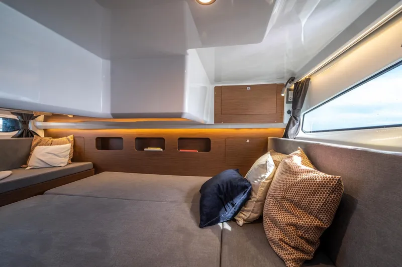 Slide: The Image of Interior of 2026 Beneteau Antares 11 OB, featuring cozy seating and modern design. - 30