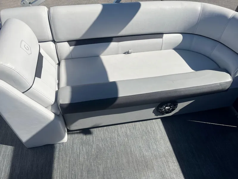 Slide: The Image of Luxurious seating on 2022 Godfrey SWEETWATER 2286 SFL pontoon boat, featuring sleek gray upholstery. - 10
