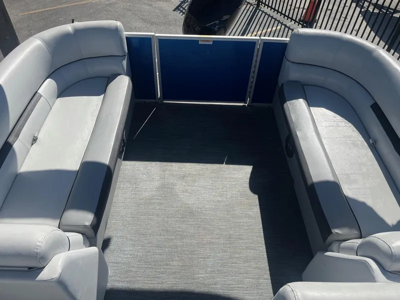 Slide: The Image of 2022 Godfrey SWEETWATER 2286 SFL pontoon boat interior with gray seating and carpet. - 11