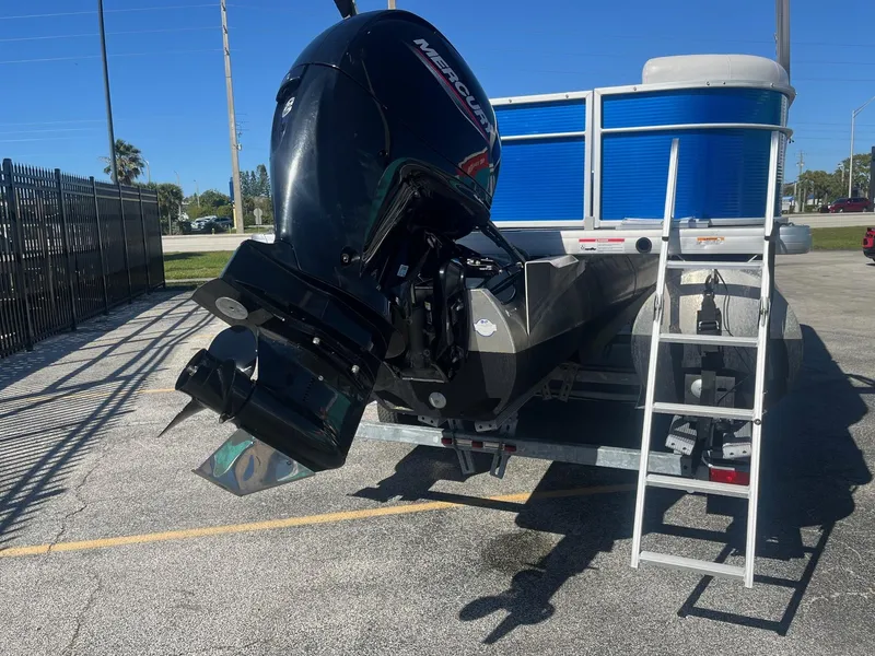 Slide: The Image of 2022 Godfrey SWEETWATER 2286 SFL boat with Mercury outboard motor on trailer. - 5