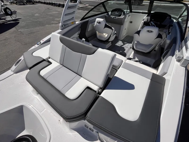 Slide: The Image of 2025 Chaparral 21 SSi OB boat interior with sleek seating and modern design. - 7