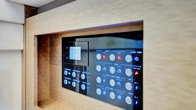 Slide: The Image of Control panel of a 2018 Prestige 680 yacht, featuring various operational buttons. - 13