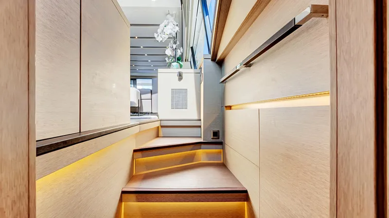 Slide: The Image of Luxurious interior of 2018 Prestige 680 yacht with modern staircase and ambient lighting. - 17