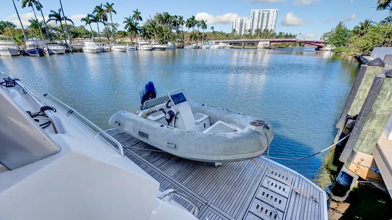 Slide: The Image of Luxury yacht Prestige 680 (2018) docked with inflatable boat on calm waters. - 22