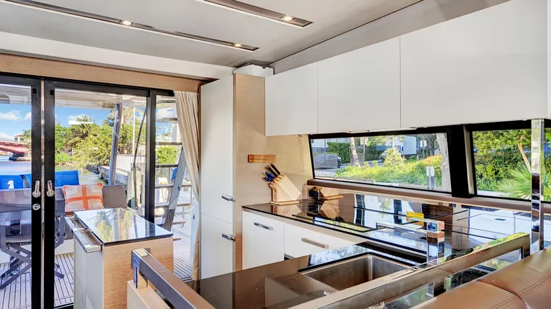 Slide: The Image of Luxurious kitchen interior of 2018 Prestige 680 yacht with modern design and outdoor view. - 41