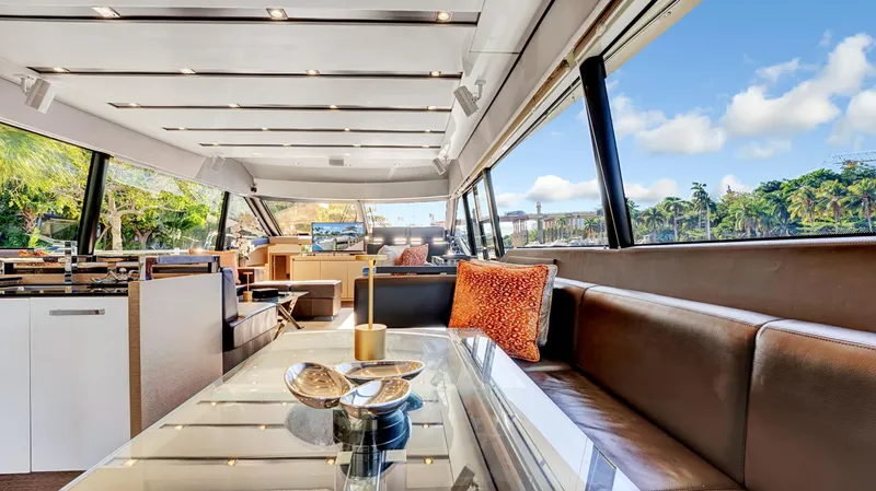 Slide: The Image of Luxurious interior of a 2018 Prestige 680 yacht with elegant seating and panoramic windows. - 42