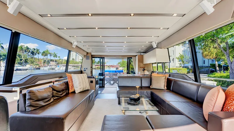 Slide: The Image of Luxurious interior of a 2018 Prestige 680 yacht with elegant seating and large windows. - 46