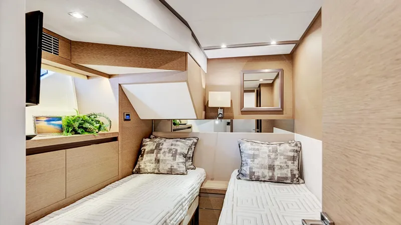 Slide: The Image of Luxurious twin cabin interior of 2018 Prestige 680 yacht, featuring modern design and cozy bedding. - 48