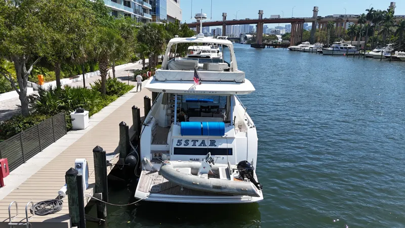 Slide: The Image of Luxury Prestige 680 yacht docked in scenic marina, 2018 model. - 8