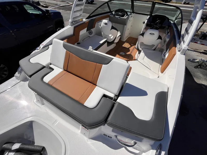 Slide: The Image of 2025 Chaparral 23 SSi OB boat interior with stylish seating and modern design. - 6