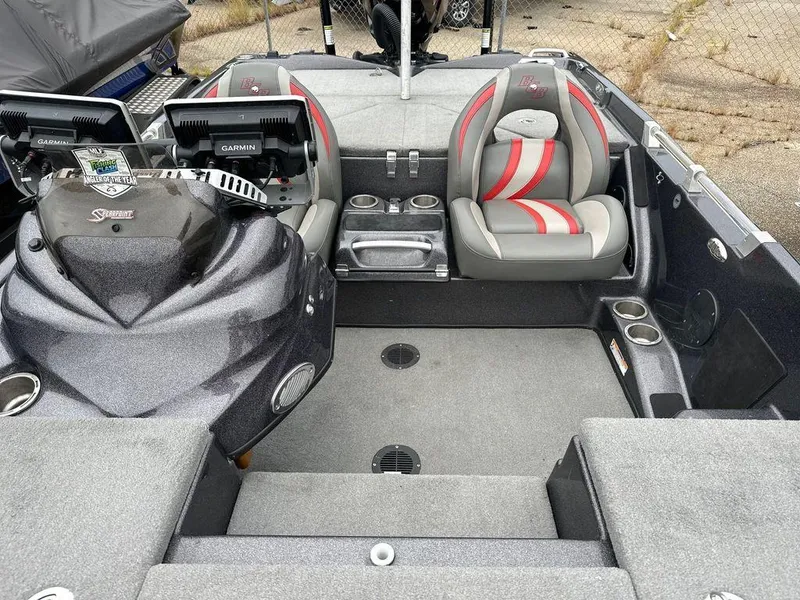 Slide: The Image of 2022 Bass Cat Cougar FTD boat interior with dual seats and advanced navigation systems. - 11