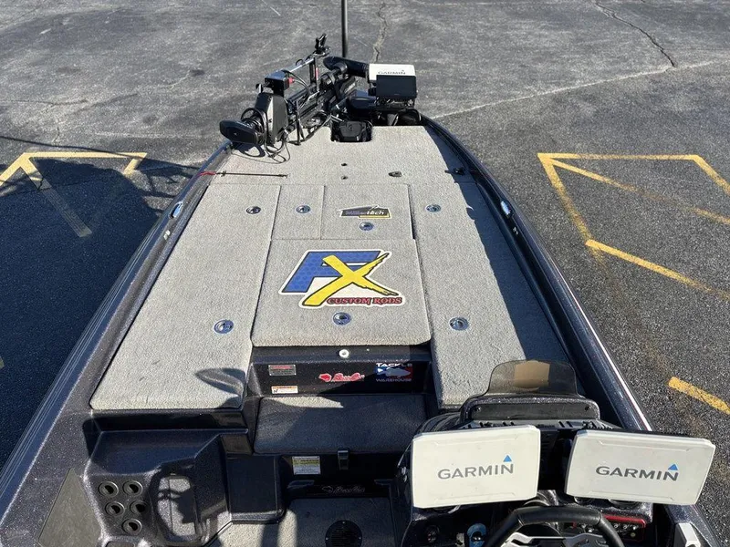 Slide: The Image of 2022 Bass Cat Cougar FTD boat deck with Garmin electronics and fishing gear. - 13