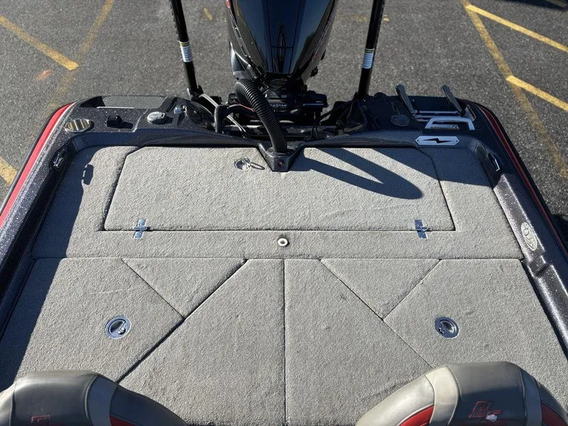 Slide: The Image of 2022 Bass Cat Cougar FTD boat deck with storage compartments and motor. - 14