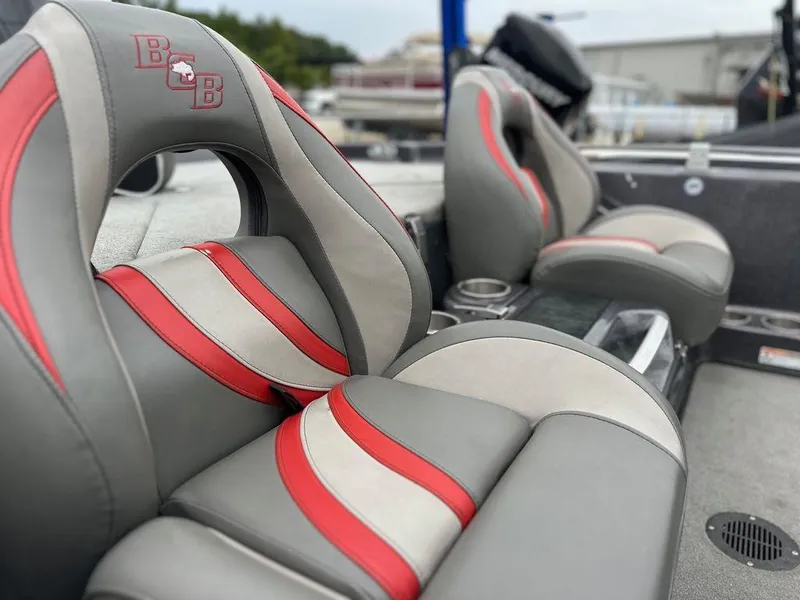 Slide: The Image of 2022 Bass Cat Cougar FTD boat seats with red and gray design, showcasing luxury and comfort. - 17