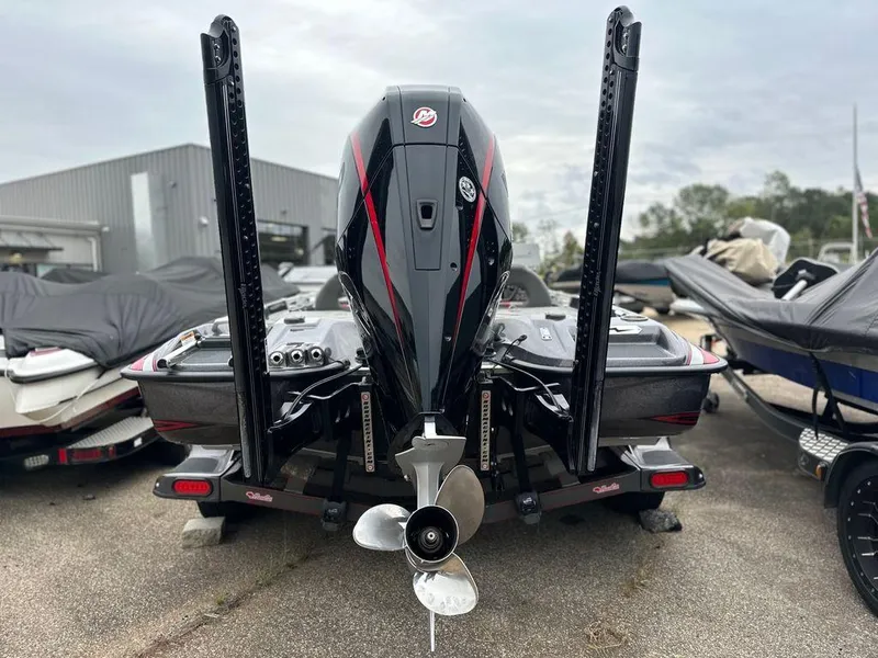 Slide: The Image of 2022 Bass Cat Cougar FTD boat, rear view with powerful outboard motor. - 18