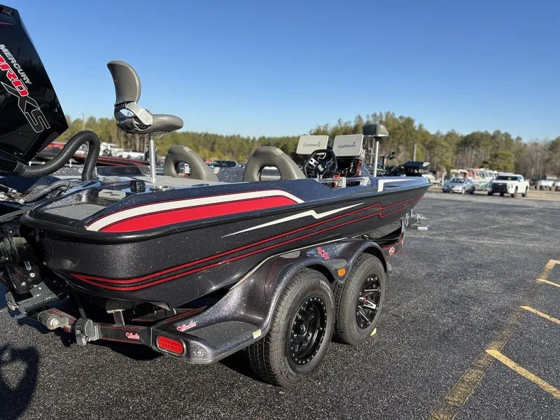 Slide: The Image of 2022 Bass Cat Cougar FTD boat on trailer in parking lot, sunny day. - 4