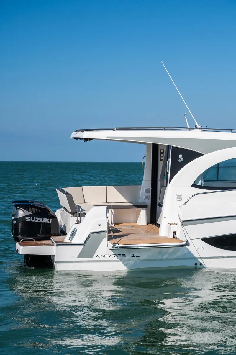 Slide: The Image of 2026 Beneteau Antares 11 OB boat on calm sea with Suzuki outboard motor. - 7