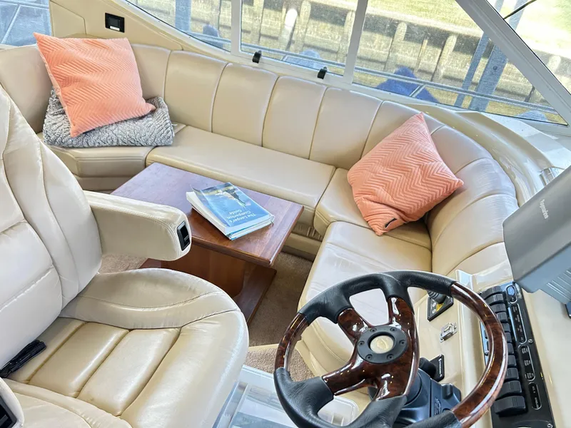 Slide: The Image of Luxurious 2004 Cruisers Yachts 5000 Sedan Sport interior with leather seating and helm. - 20
