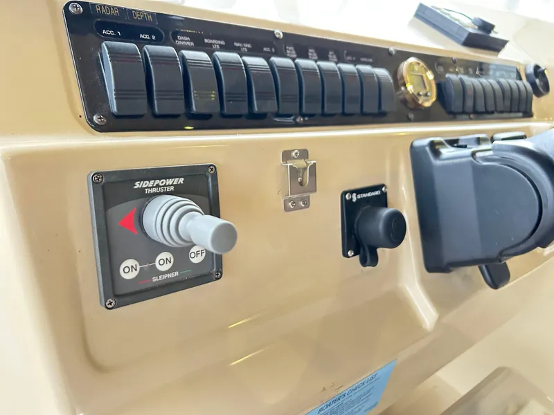 Slide: The Image of Control panel of 2004 Cruisers Yachts 5000 Sedan Sport with Side-Power thruster. - 23