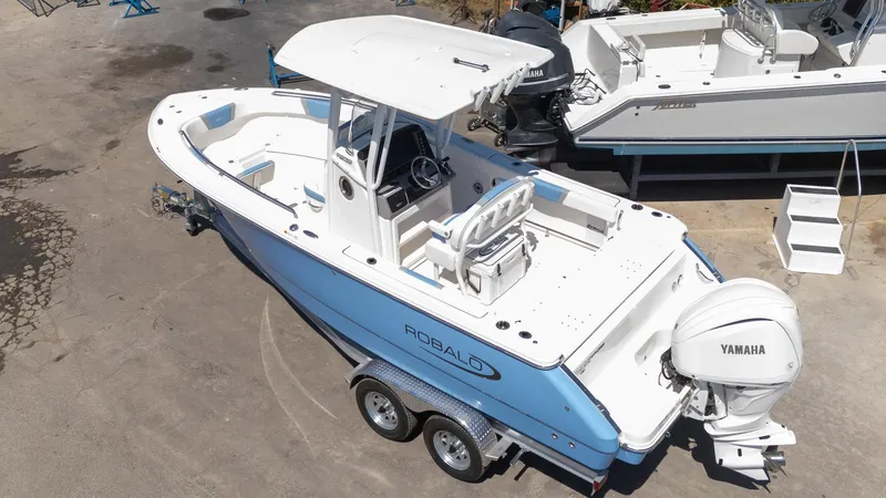Slide: The Image of 2025 Robalo 232 Explorer boat with Yamaha engine on trailer, aerial view. - 27