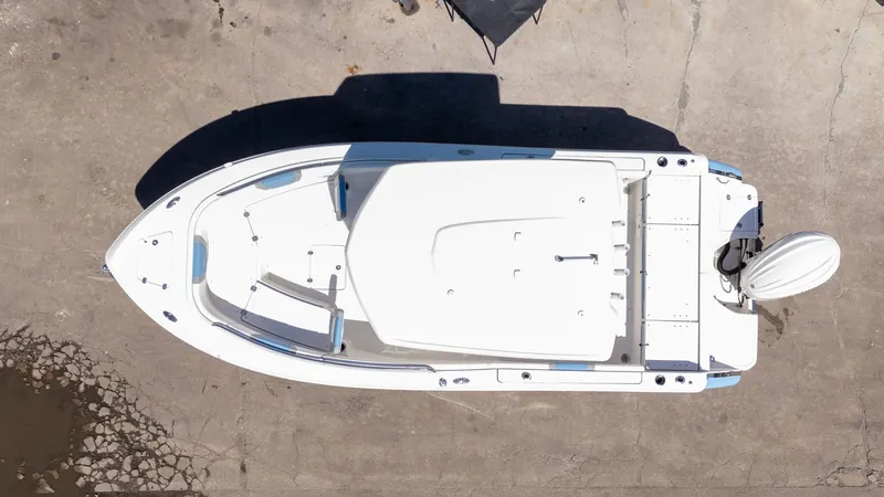 Slide: The Image of Top view of 2025 Robalo 232 Explorer boat on concrete surface. - 28