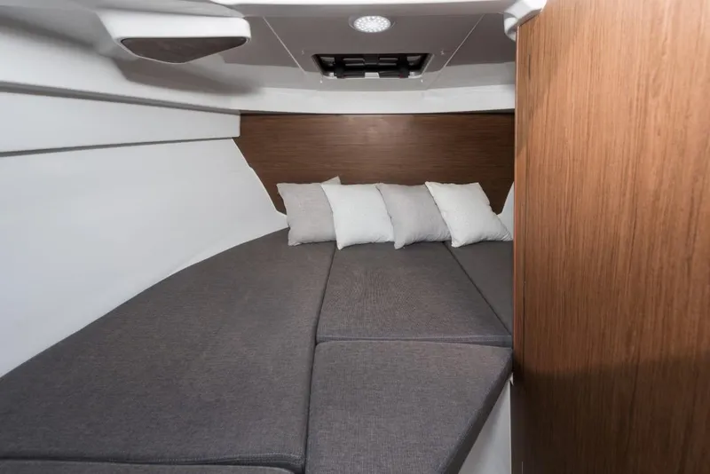 Slide: The Image of 2025 Beneteau Antares 7 cabin interior with cozy bedding and modern design. - 15