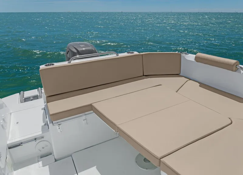 Slide: The Image of 2025 Beneteau Antares 7 boat with spacious deck seating on open water. - 6