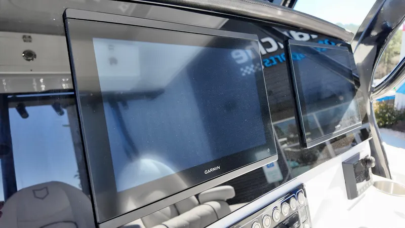 Slide: The Image of Dashboard of 2025 Sea Fox 288 Commander with Garmin display screens. - 11