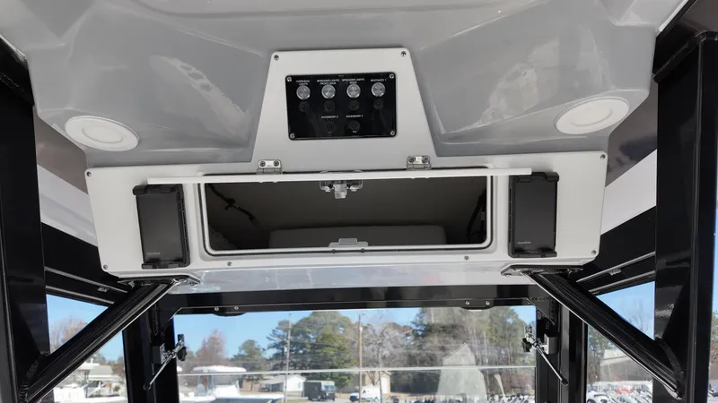 Slide: The Image of 2025 Sea Fox 288 Commander boat console with storage compartment and control panel. - 12