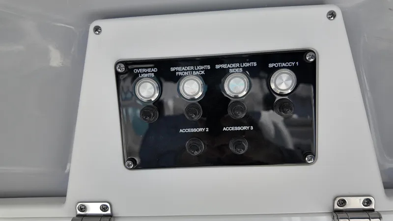 Slide: The Image of Control panel of 2025 Sea Fox 288 Commander boat with labeled switches. - 13