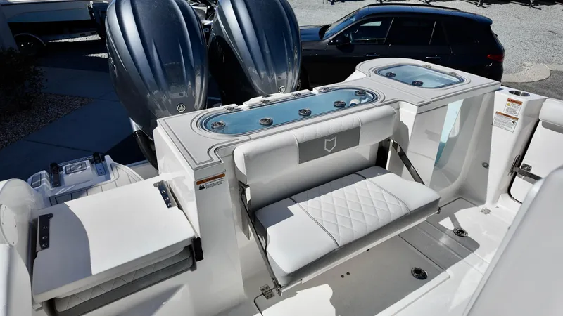 Slide: The Image of 2025 Sea Fox 288 Commander boat interior with seating and dual engines. - 20