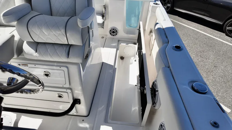 Slide: The Image of 2025 Sea Fox 288 Commander interior with seating and storage compartments. - 24