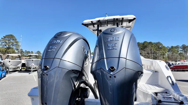Slide: The Image of 2025 Sea Fox 288 Commander with dual Yamaha 300 V6 engines, parked outdoors. - 3