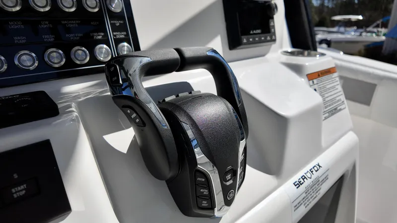 Slide: The Image of Control panel of 2025 Sea Fox 288 Commander boat with throttle lever. - 7