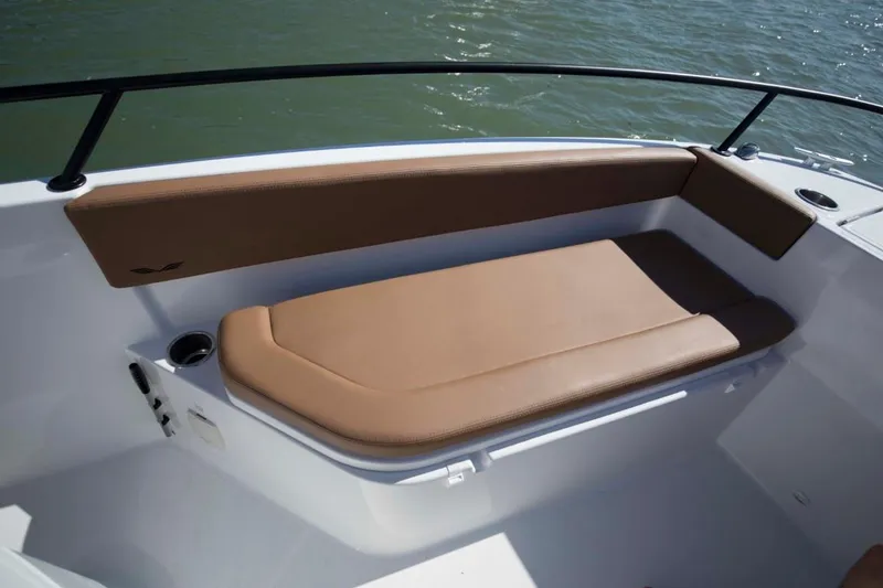 Slide: The Image of 2025 Beneteau Flyer 8 SPACEdeck boat seating area with brown cushions. - 11