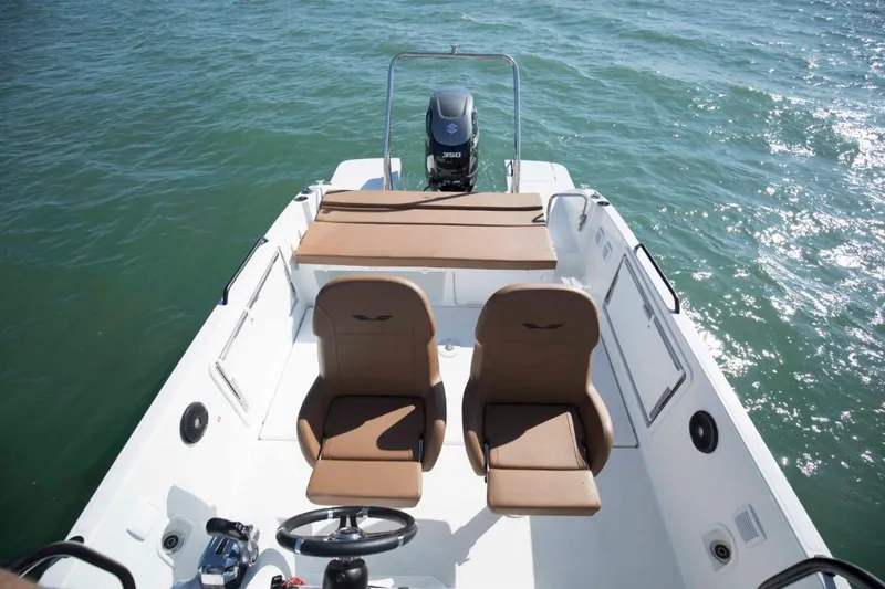 Slide: The Image of 2025 Beneteau Flyer 8 SPACEdeck boat interior with brown seats and outboard motor. - 21