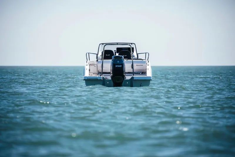 Slide: The Image of 2025 Beneteau Flyer 8 SUNdeck boat on open water, rear view. - 11