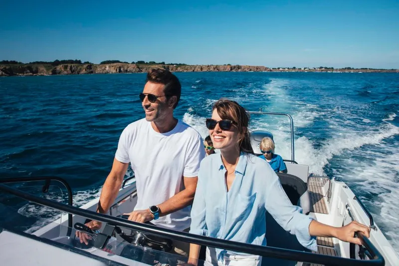 Slide: The Image of Couple enjoying a ride on a 2025 Beneteau Flyer 8 SUNdeck boat. - 17