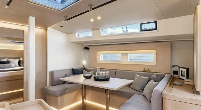 Slide: The Image of Luxurious interior of 2025 Beneteau Oceanis Yacht 54 with modern seating and dining area. - 17