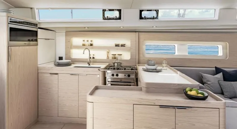 Slide: The Image of Luxurious kitchen interior of 2025 Beneteau Oceanis Yacht 54 with modern amenities and ocean view. - 18