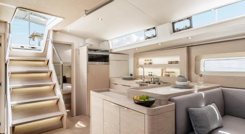 Slide: The Image of Luxurious interior of 2025 Beneteau Oceanis Yacht 54, featuring modern kitchen and seating area. - 20