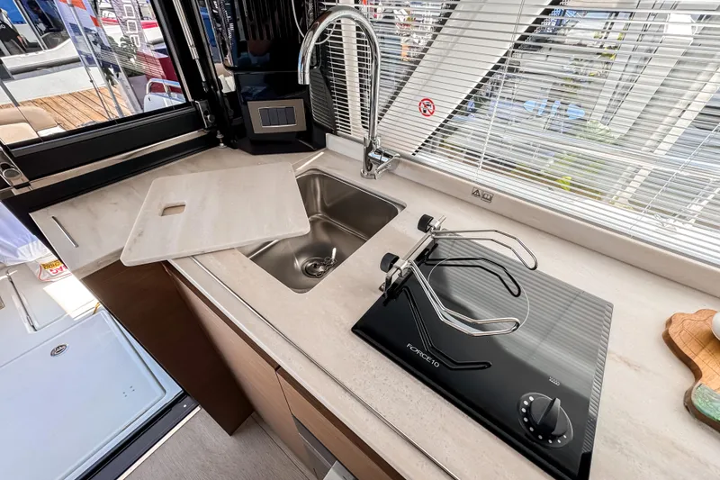 Slide: The Image of Modern kitchen on Wellcraft 44 Explorer 2026 with sink and stove. - 13
