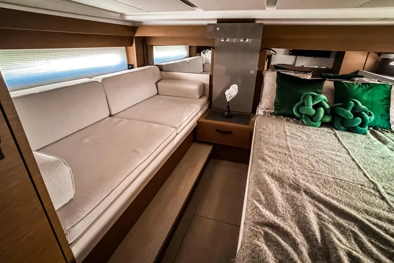 Slide: The Image of Interior of 2026 Wellcraft 44 Explorer with sofa and bed. - 26