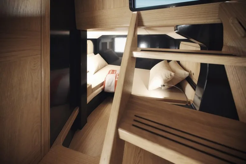 Slide: The Image of Cozy cabin interior of 2025 Windy SRL/SR60 with wooden ladder and bedding. - 11